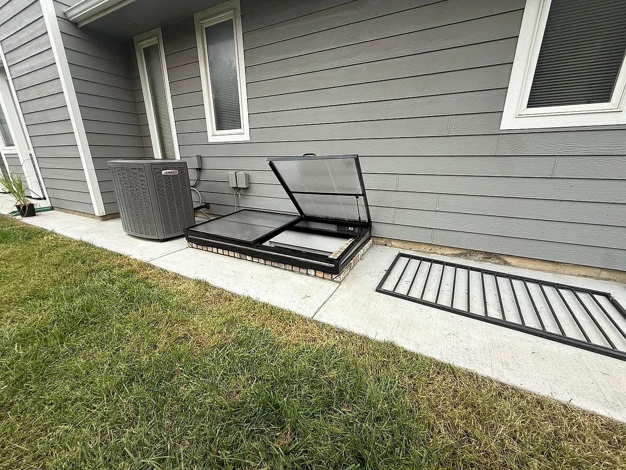 Aluminum egress cover with the hatch open
